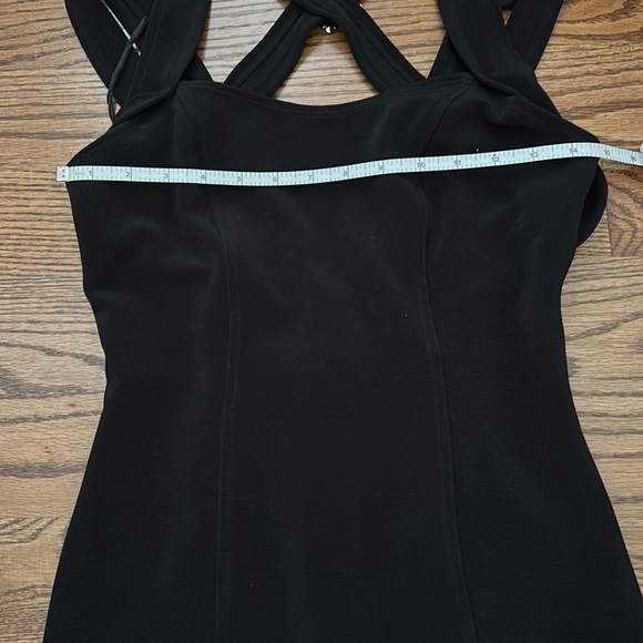 Black evening dress. Slit on left front. Strappy back with silver buckles. - Picture 5 of 8